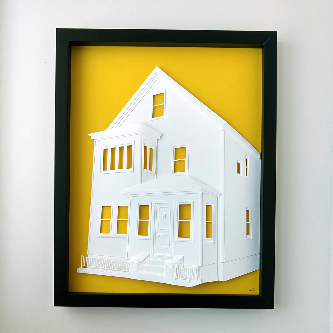 a cut out of a white house on a yellow background