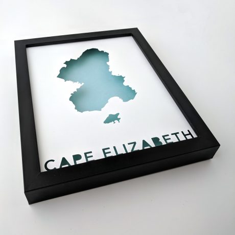 a black frame with a cut out map of cape elizabeth