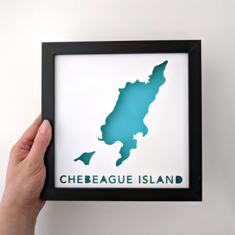Framed map of Chebeague Island, Maine, held in hand