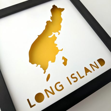 Framed map of Long Island, Maine with yellow background at an angle