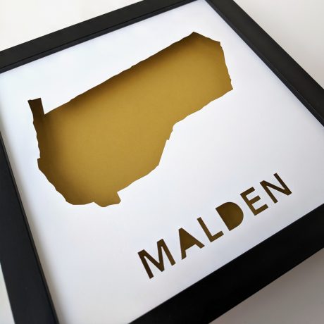 a framed poster with the word malden cut into it