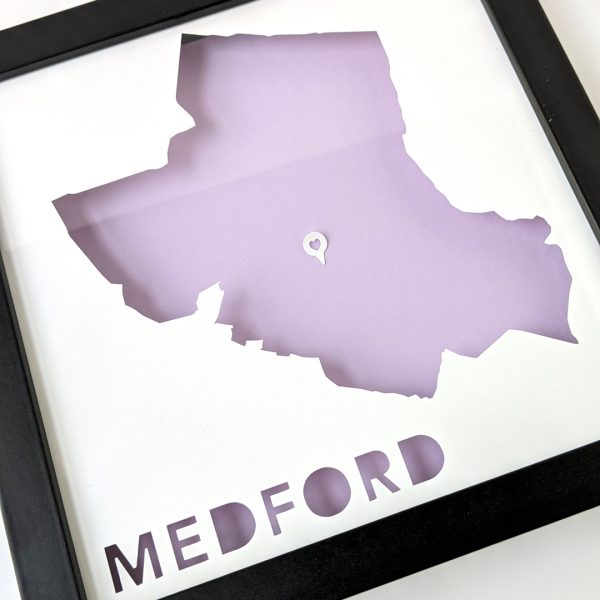 Framed map of Medford, MA with a heart-shaped place marker indicating the location of the customer's home.