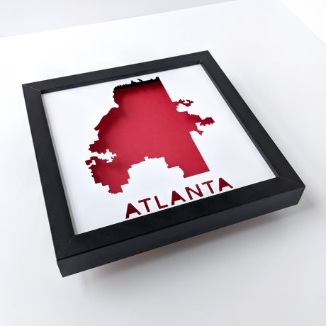 a black frame with a red and white map of the state of atlanta
