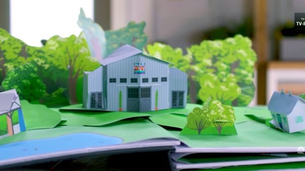 Still from the "Making It" title sequence showing a pop-up book version of the barn surrounded by trees