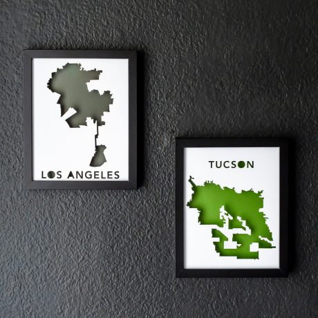 two framed maps hang on the wall