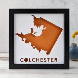 Orange and white map of Colchester, VT with the text below