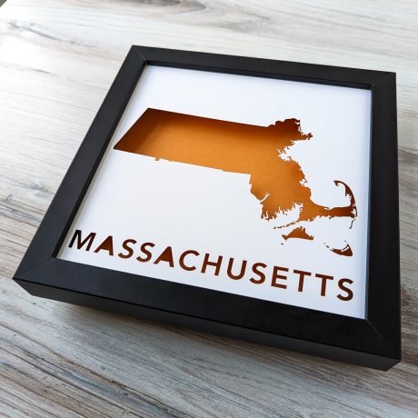 a black frame with a map of massachusetts in it