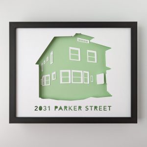 A house portrait silhouette of a two story house with a mint green background in a black frame