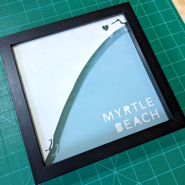 a black frame with the words myrtile beach on it