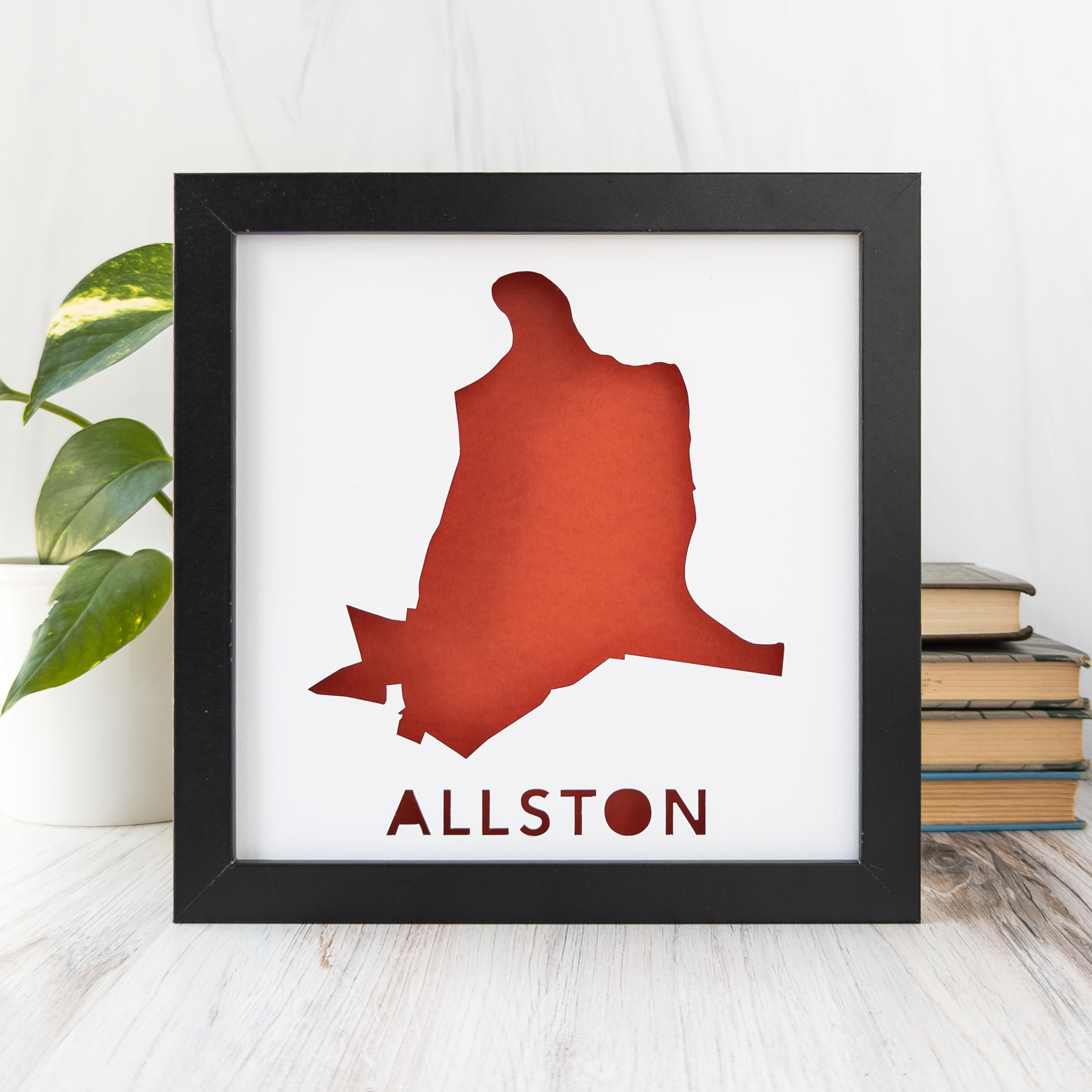 a framed dark orange map of Allston, a neighborhood of Boston, MA