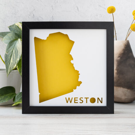 a yellow and black framed map of Weston, MA