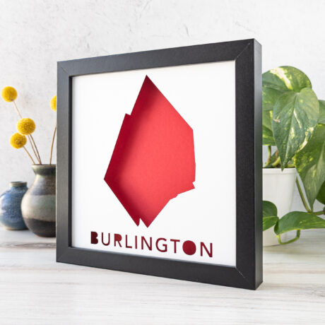 a picture frame with a red paper cut out of it