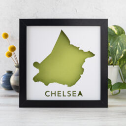 a black frame with a green map of Chelsea, MA