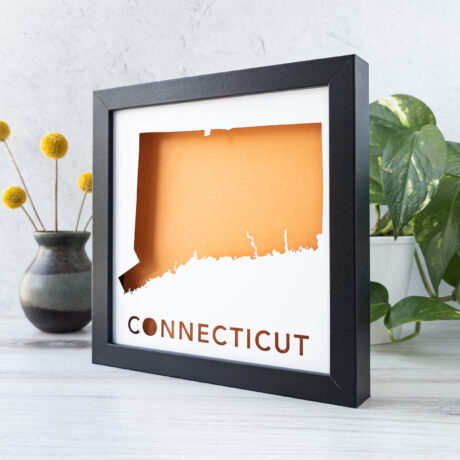 a black frame with a hole in the middle that says conect cut