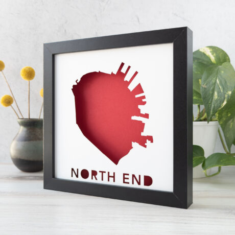 a picture frame with a red map and the words north end on it