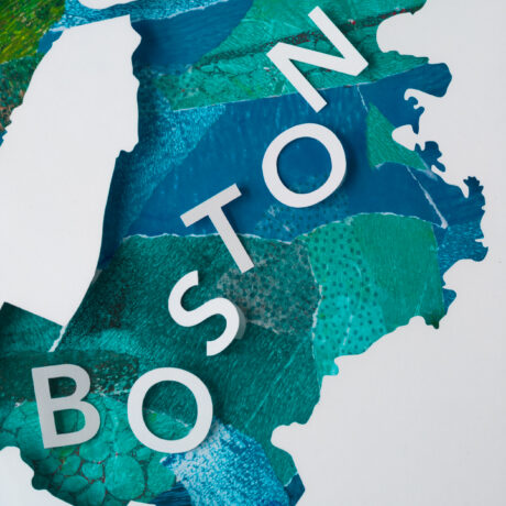 A close up of 3D paper letters that spell "Boston" on a blue and green textured collaged background