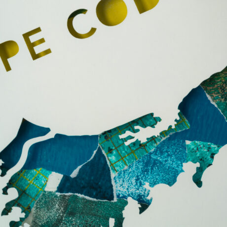 A closeup of the letters "PE COD" and the middle part of the Cape Cod map