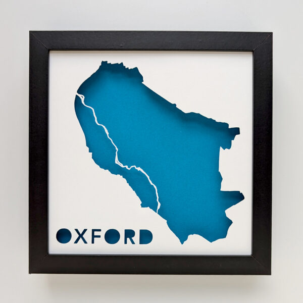 a picture of a blue map of Oxford, England in a black frame